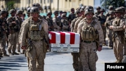 US soldiers act as pallbearers for the 13 service members killed in a bombing at Kabul airport in August 2021.