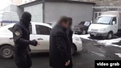 Armenia -- A screenshot of a National Security Service vide of the arrest of defense contractor Davit Galstian, February 1, 2021