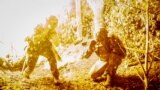 TOPSHOT - This handout photograph taken on June 20, 2024 and released by the Press service of the 24th mechanized brigade shows servicemen of the 24th mechanized brigade named after King Danylo firing mortar from the front line towards Russian positions i