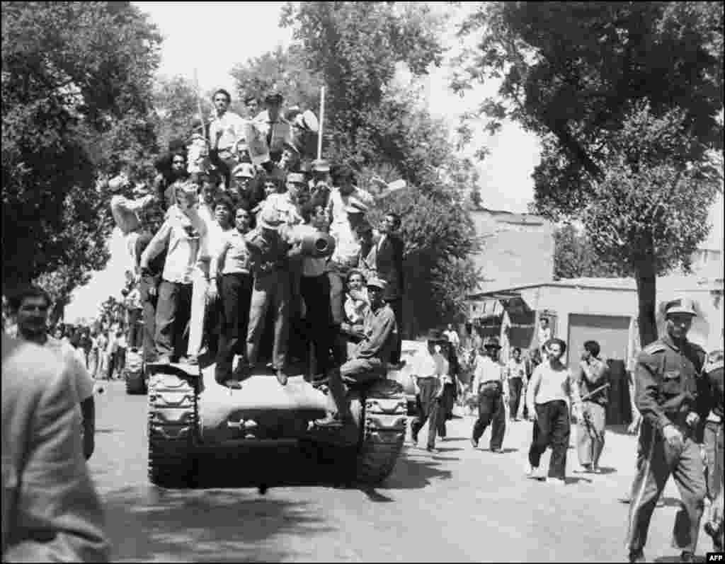 Iranian Army officers and supporters of the monarchy gather on August 27, shortly after the shah returned from a brief period of exile to reclaim power.
