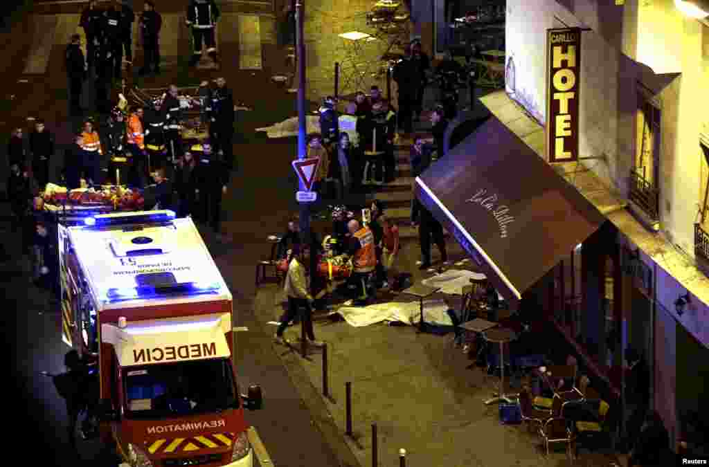 Rescue service personnel work frantically at the scene of the attack. 
