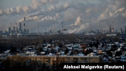Smoke rises from an oil refinery behind the city of Omsk, Russia. European countries have been cutting their dependence on Russian oil following the country's unprovoked, large-scale invasion of Ukraine in February 2022.
