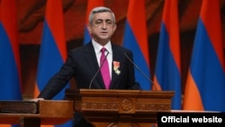 Armenia - President Serzh Sarkisian is holding his right hand on the Bible and the Constitution during his inauguration, Yerevan,09Apr2013