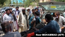 A victim is brought to the hospital after the mortar attack on June 29.