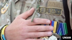 Ukraine -- Ukrainian serviceman during a rally on Independence Square in Kyiv, May 18, 2016