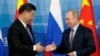 Кытайдын төрагасы Си Цзиньпин менен Орусиянын президенти Владимир Путин. 11-сентябрь, 2018-жыл. 